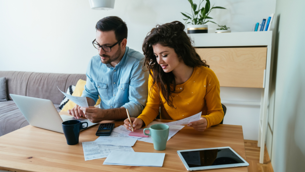 Two young guys working at their laptop