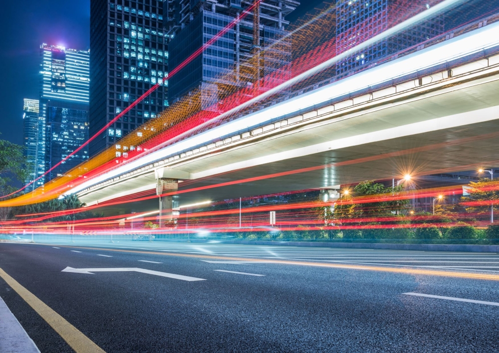 Colorful rays of light racing through the city
