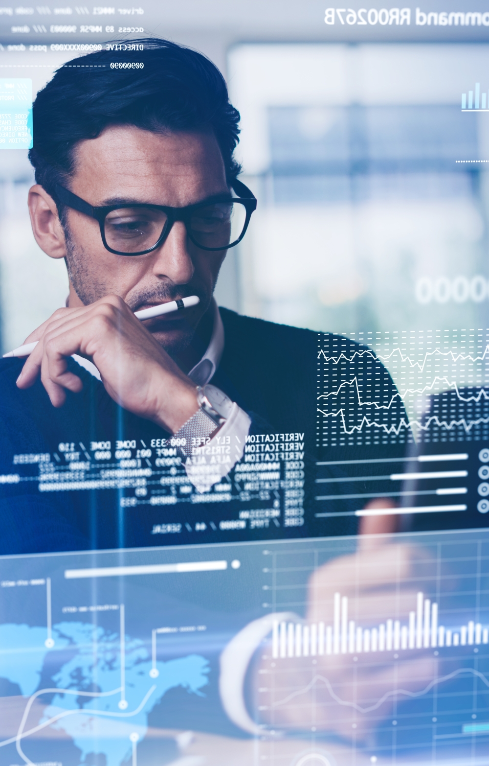 Person looking at a laptop screen with lots of data