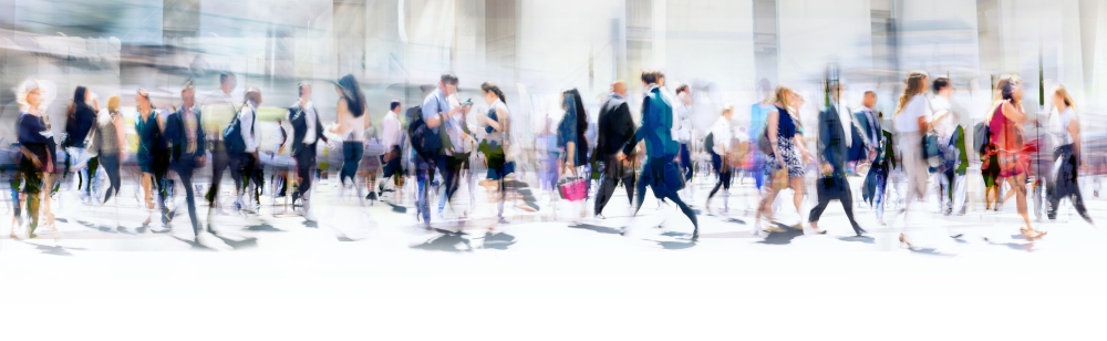 Blurry picture of business people walking in an open environment