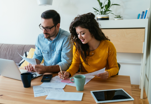 Two young guys working at their laptop