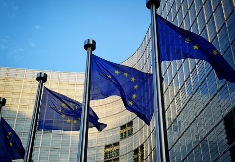 EU flags in front of European Commission building in Brussels