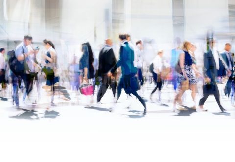 Blurry picture of business people walking in an open environment